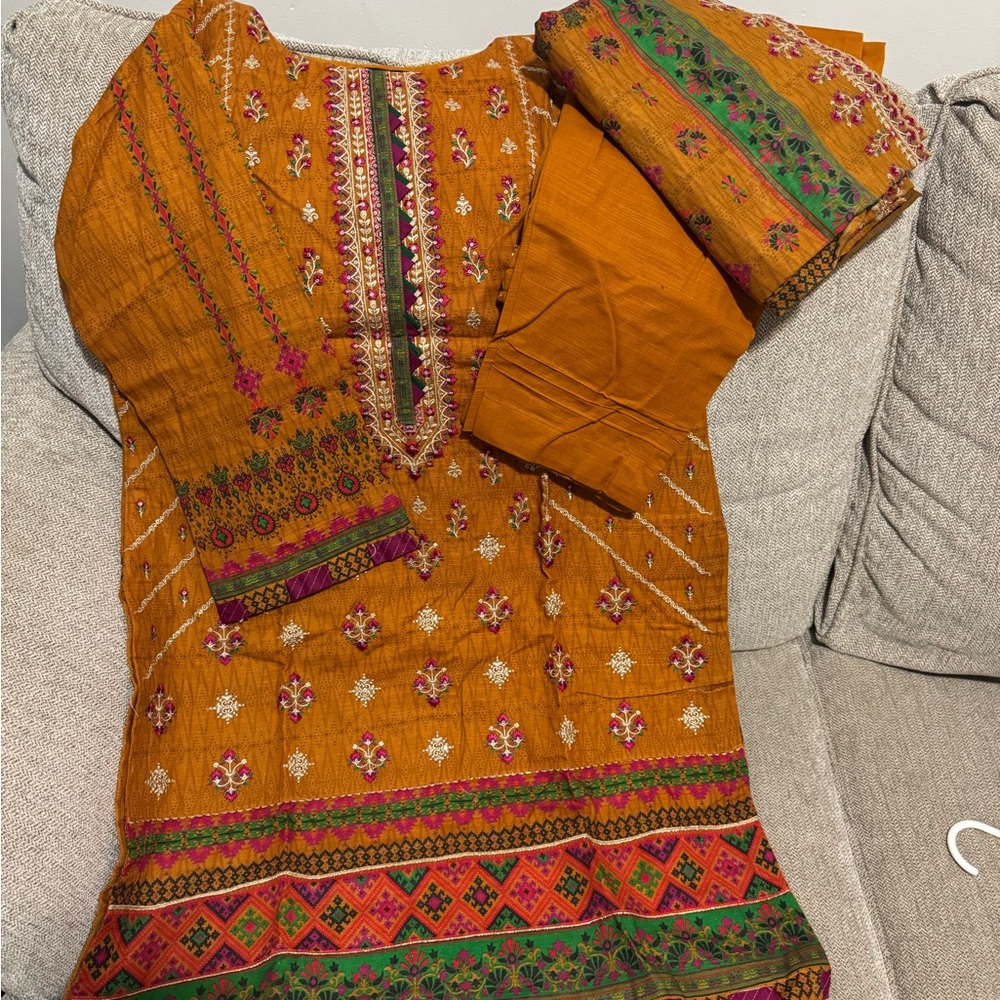 Vibrant Orange Embroidered Dress with Floral Patterns